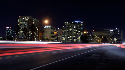 Fototapeta na wymiar San Jose Downtown and Car Light Trails on California State Route 87 during Rush Hour. San Jose, California, USA.