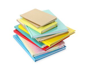 Stack of different colorful hardcover planners on white background