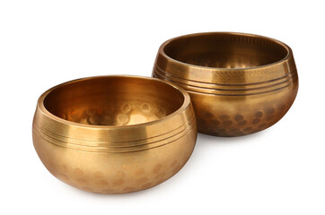Golden singing bowls on white background. Sound healing