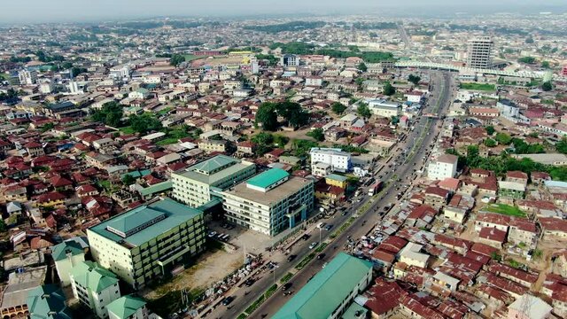 Abeokuta Town in Nigeria's Ogun State in West Africa - aerial establishing shot with pull back flyover