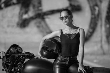 woma in black with a motorcycle