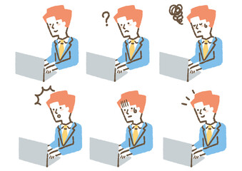 スーツを着てパソコンを使っている_色