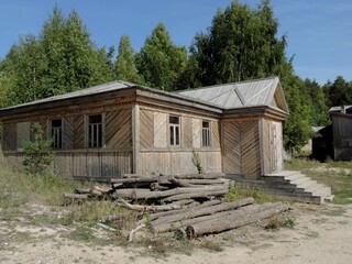 Scenery for the film, a wooden house on the edge of a deciduous forest.