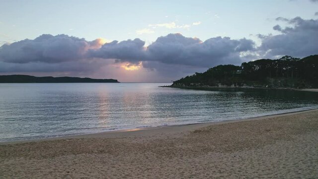 Sunrise at the seaside with clouds from Pearl Beach on the Central Coast, NSW, Australia.