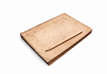 Vintage book with pencil on white background. Antique object. An old notebook or diary that is aged.