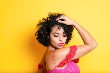 beauty portrait of young hispanic model with curly hair and beautiful skin