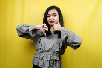 Beautiful young woman with hands like or dislike, yes or no, happy or sad, comparing two things, advertising, isolated