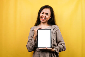 Beautiful young woman hands holding tablet with blank or white screen, presenting something, promoting product, cheerful and confident, advertisement, isolated