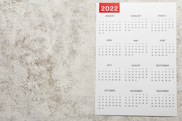 Paper calendar for year 2022 on grunge background