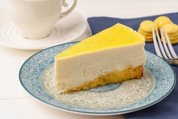 Lemon cheesecake on the plate close up