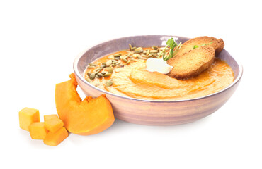 Bowl with delicious pumpkin cream soup on white background