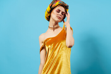 pretty woman in multicolored turban attractive look Jewelry smile isolated background