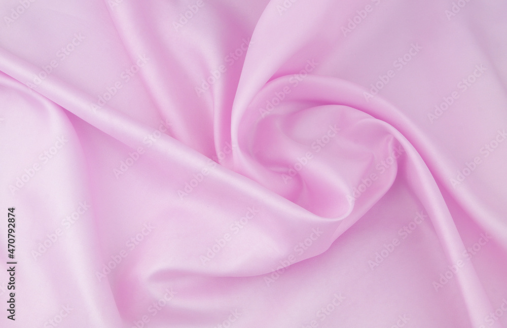 Wall mural pink satin or silk fabric background.