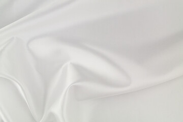 White satin or silk fabric background. Wedding backdrop or design element.	