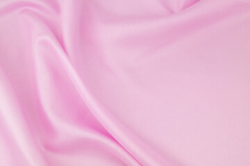 Obraz premium Pink satin fabric background. Wedding backdrop or holidays design element.