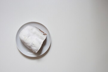 Fototapeta na wymiar Flat lay of Christmas bread on white plate against white background