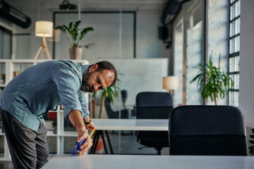 Fototapeta premium Businessman taking care about protection measures at work during pandemic