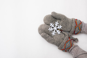 Woman hand with chrismas toy isolated on white