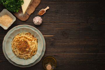 Plate PASTA with BREADCRUMBS Like an Italian (Pasta Ca' Muddica) and ingredients with copy space