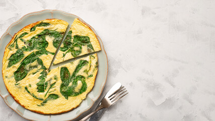 Plate SPINACH FRITTATA top view and main ingredients with copy space