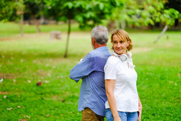 Fototapeta premium Portrait caucasian senior woman and old man, couple elder in love happy in park