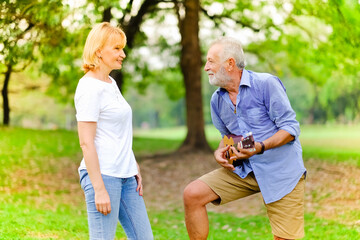 Fototapeta premium Portrait caucasian senior woman and old man, couple elder in love happy in park
