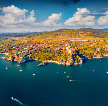 Aerial landscape photography. Colorful summer view from flying drone of Duino Castle. Attractive morning scene of Adriatic coast of Italy, Europe. Wonderful cityscape of Duino town.