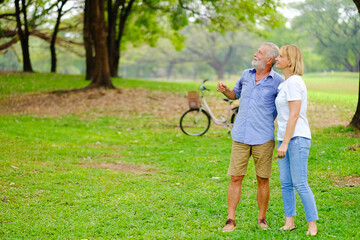 Portrait caucasian senior woman and old man, couple elder in love happy in park