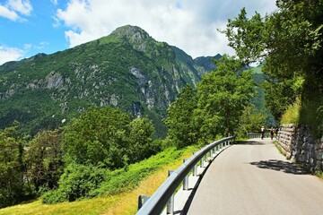 Fototapeta na wymiar Italy-view of cyclists in the mountains