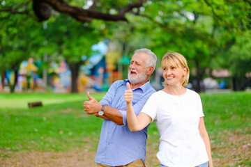 Fototapeta premium caucasian senior woman and old man, couple elder in love happy in park