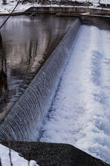 Winter promenade walk at riverbank of River Isar in Munich Muenchen, Germany on ice cold day with...