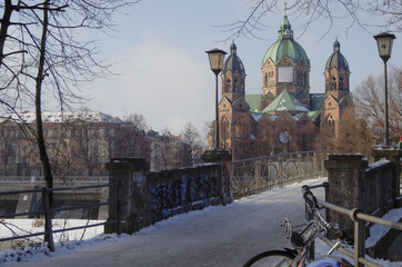 Winter promenade walk at riverbank of River Isar in Munich Muenchen, Germany on ice cold day with...