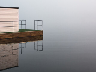 fog over the river houseboat at sunset
