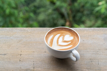 Coffee latte art with nature background