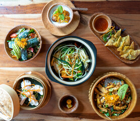 Shot from above, collection of plates of vietnamese asian food cuisine.