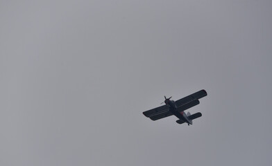 an agricultural plane during a flight between the fields