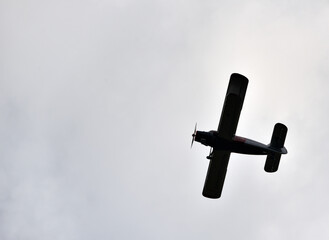 an agricultural plane during a flight between the fields
