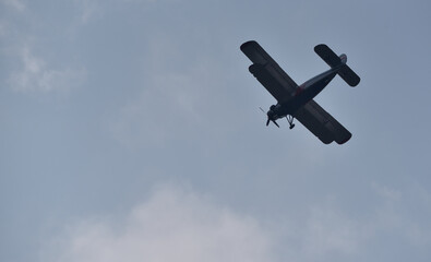 an agricultural plane during a flight between the fields