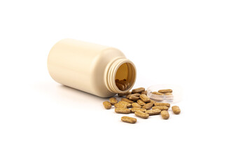 Plastic bottle of Nutrition supplements, brown vitamin pills on white background.
