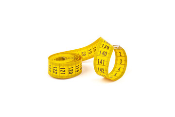 Yellow measuring tape spiral, isolated on white background.