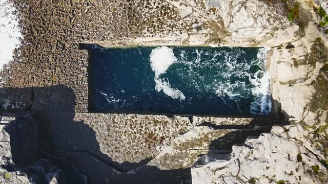 Drone footage of the Wormhole on Inishmore, one of the Aran Island, Ireland.