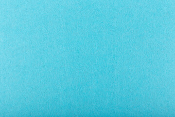 Blue fuzzy and fluffy felt fabric close up. Fleece cozy felt background with space for text. Space for text, template for design