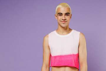 Young blond hispanic latin gay man 20s with make up wearing fashionable bright pink top look camera...