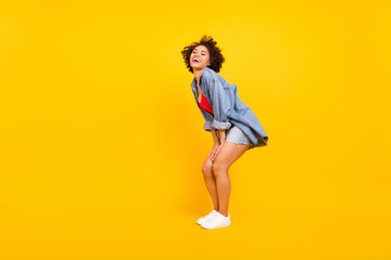 Fototapeta na wymiar Full length photo of young happy cheerful positive dark skin woman enjoy smile isolated on yellow color background