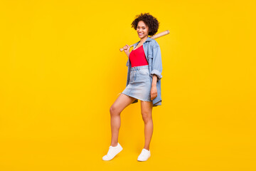 Fototapeta na wymiar Photo of gorgeous hipster lady hold baseball bat wear denim jacket short skirt isolated yellow color background