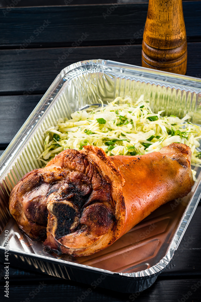 Sticker pork knuckle with sauerkraut salad. germany traditional food