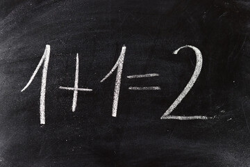 mathematical problem with chalk on the blackboard