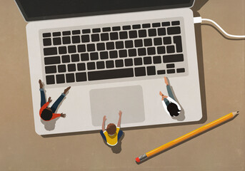 Kids sitting at laptop keyboard

