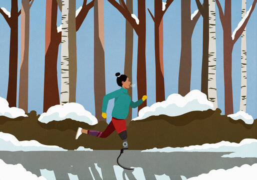 Female amputee with prosthetic leg jogging in snowy park
