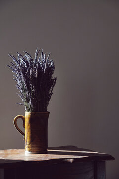 Bouquet of lavender in rustic jug vase

